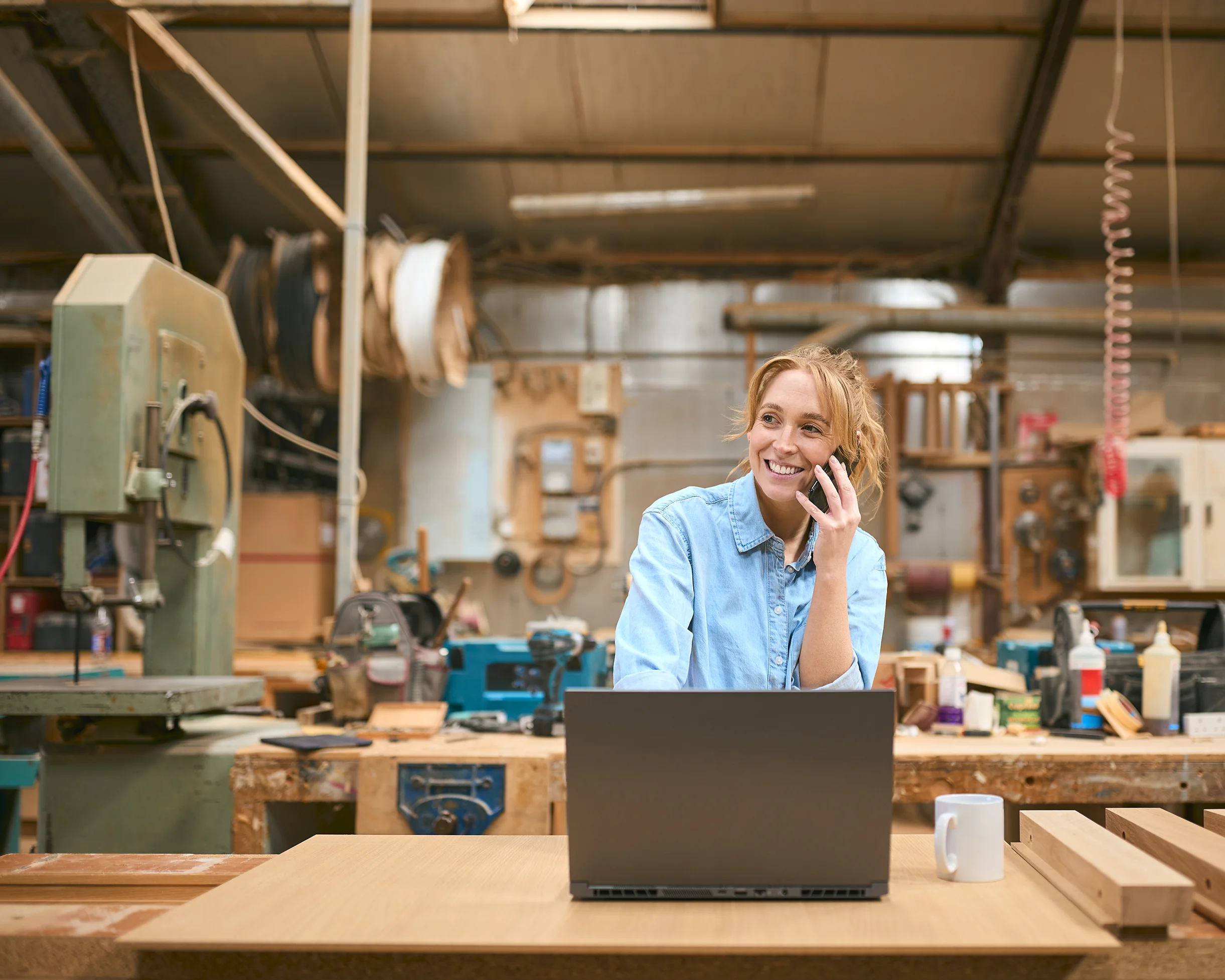 Woman on the phone with Utilita about her small business energy, getting instant support from her dedicated account manager.